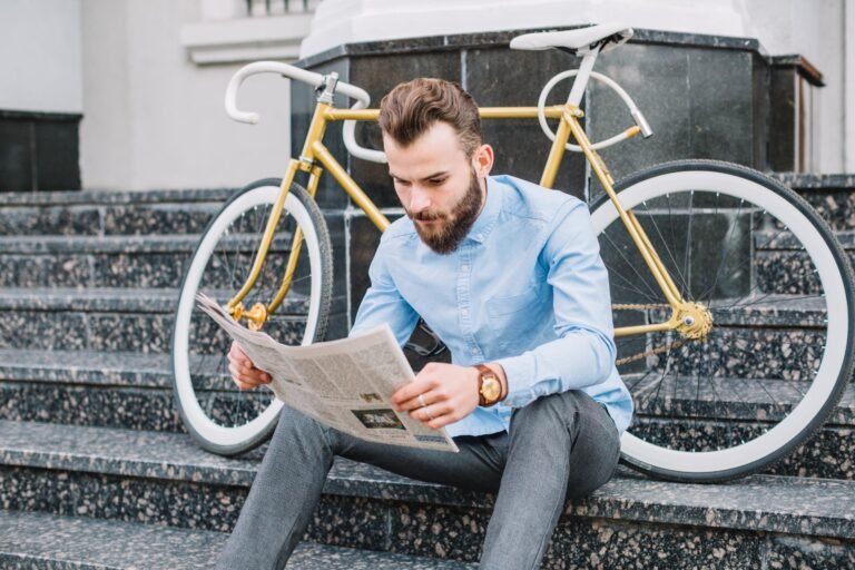 man-stairs-reading-newspaper